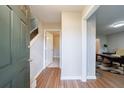 Light and bright entryway with wood flooring, leading to stairs and other rooms at 4154 Oakwood Way, Duluth, GA 30096