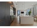 Contemporary kitchen features dark wood cabinets and stainless steel appliances at 40 12Th Ne St # 1903, Atlanta, GA 30309