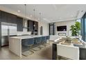 Modern kitchen with stainless steel appliances and a large island at 40 12Th Ne St # 1903, Atlanta, GA 30309