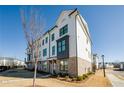 Side view of townhome showcasing the brick and white exterior at 601 Millcroft Blvd, Buford, GA 30518