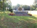 Mountain Creek community sign featuring stone masonry, landscaping, and neighborhood branding at 2225 Mountain Creek Dr, Tucker, GA 30087