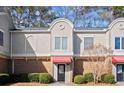 Inviting brick front exterior of townhome with landscaping at 3301 Henderson Mill Rd # A2, Atlanta, GA 30341
