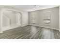 Bright living room with hardwood floors and high ceilings at 3886 Cedar Trace Ln, Ellenwood, GA 30294