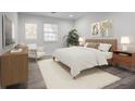 Spacious primary bedroom with hardwood floors and ample closet space at 1647 Raleigh Se Cir, Marietta, GA 30067