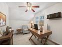 Bright home office features built-in shelving and wood desk at 19 Roving Hills Cir, Cartersville, GA 30121