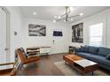 Bright living room featuring hardwood floors, a comfy sofa, and modern decor at 1018 Westmont Sw Rd, Atlanta, GA 30311