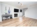 Living room with hardwood floors, fireplace, and built-in shelving at 592 Waynes Ct, Atlanta, GA 30354