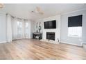 Living room features hardwood floors, fireplace, and large windows at 592 Waynes Ct, Atlanta, GA 30354