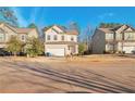 Two story house on a tree lined street with other houses visible at 157 Parkview Place Dr, Mcdonough, GA 30253