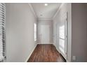 Bright foyer with wood flooring and neutral walls at 157 Parkview Place Dr, Mcdonough, GA 30253