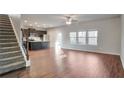 Spacious living room with hardwood floors and kitchen island visible at 157 Parkview Place Dr, Mcdonough, GA 30253