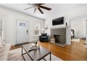 Living room with hardwood floors, fireplace, and view into the bedroom at 1320 Hosea L Williams Ne Dr, Atlanta, GA 30317