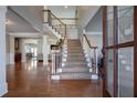 Two-story foyer with hardwood floors and curved staircase at 1429 Wood Iris Ln, Lawrenceville, GA 30045