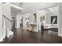 Bright foyer featuring hardwood floors, high ceilings, and open access to living spaces at 1250 Atherton Park, Roswell, GA 30076