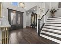 Grand foyer featuring a staircase, chandelier, and elegant decor at 1250 Atherton Park, Roswell, GA 30076