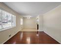 Bright living room featuring hardwood floors and a view of the front yard at 3343 Charlemagne Dr, Decatur, GA 30034