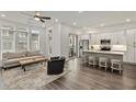 Open concept kitchen and living area with modern appliances and hardwood floors at 137 Devore Rd, Alpharetta, GA 30009