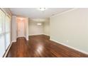 Living room with hardwood floors and neutral walls at 3141 Bellgreen Way, Decatur, GA 30032