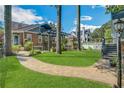Lush backyard with a brick patio, pergola, and a well-manicured lawn, perfect for entertaining at 1290 Pasadena Ne Ave, Atlanta, GA 30306