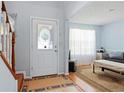 Bright entryway with hardwood floors and view into living room at 1215 Brook Meadow Ct, Lawrenceville, GA 30045