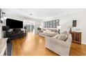 Spacious living room featuring hardwood floors, modern decor, and a comfortable seating arrangement at 2732 Suwanee Se Way, Marietta, GA 30067