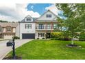 Two-story house with white siding, a green lawn, and a large front yard at 5060 Lloyd Ln, Cumming, GA 30040