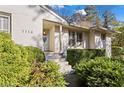 Front entrance of a charming ranch home with a light green door at 1116 Citadel Ne Dr, Atlanta, GA 30324