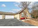 Nice one-story house with a two car garage and a paved driveway at 2191 Rockbridge Sw Rd # 202, Stone Mountain, GA 30087