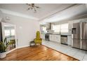 Modern kitchen with stainless steel appliances and white cabinets at 1574 Mayflower St, Atlanta, GA 30311