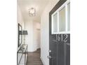 Welcoming entryway features modern lighting, stylish console table, and a sleek mirror at 1621 Aiden Way # 57, Conyers, GA 30013