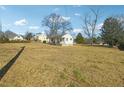 View of the home from the side yard at 1111 Park Nw Cir, Conyers, GA 30012