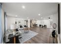 Spacious open-concept living area with modern furnishings and hardwood floors throughout at 3308 Wildwood Sw Dr, Marietta, GA 30060