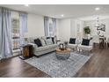 Cozy living room with stylish decor, large windows, and hardwood floors, perfect for relaxation at 3308 Wildwood Sw Dr, Marietta, GA 30060