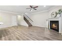 Living room features hardwood floors, fireplace, and staircase at 6233 Thorncrest Dr, Tucker, GA 30084