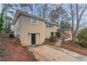 Brick home with attached garage and a partially visible driveway at 2906 Monterey Dr, Decatur, GA 30032