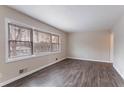 Bright living room with large windows and dark gray vinyl flooring at 2906 Monterey Dr, Decatur, GA 30032