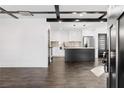 Open concept kitchen with island, stainless steel appliances, and dark hardwood floors at 1816 Ledo Ave, Decatur, GA 30035