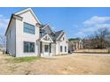 Beautiful two-story home with a well-manicured lawn and striking architectural details, perfect for Gathering living at 1010 Nours Cir, Lawrenceville, GA 30045