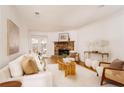 Bright living room features stone fireplace, hardwood floors, and comfy seating at 1170 Brookhaven Woods Ne Ct, Atlanta, GA 30319