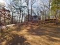 House nestled in a wooded area, offering privacy at 1508 Towne Harbor Ln, Woodstock, GA 30189