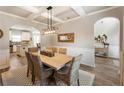 Bright dining room with a wood table and wicker chairs at 1590 Walking Horse Trl, Cumming, GA 30041