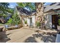 Back patio with stone fireplace, bench seating, and room for entertaining at 250 Lakeview Ne Ave, Atlanta, GA 30305