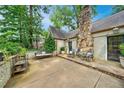 Relaxing back patio includes seating and stone fireplace at 250 Lakeview Ne Ave, Atlanta, GA 30305