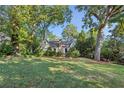 Charming home featuring a stone chimney and meticulously maintained landscaping at 250 Lakeview Ne Ave, Atlanta, GA 30305