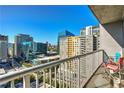 A condo balcony overlooking the city, furnished with chairs at 44 Peachtree Ne Pl # 1622, Atlanta, GA 30309