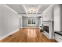 Light-filled living room with hardwood floors, fireplace and high ceilings at 1271 Fenway Cir, Decatur, GA 30030