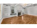 Spacious living room with hardwood floors, fireplace and built-in shelving at 1271 Fenway Cir, Decatur, GA 30030