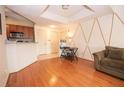 Living room with hardwood floors and a unique wall accent at 1250 Parkwood Cir # 2312, Atlanta, GA 30339