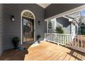 Inviting front porch with decorative wreath, potted plants, and a 'Welcome' mat at 889 City Park Se Dr, Atlanta, GA 30312