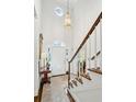 Bright and airy two-story entryway with hardwood floors and elegant staircase at 11 Ivy Chase Ne, Atlanta, GA 30342